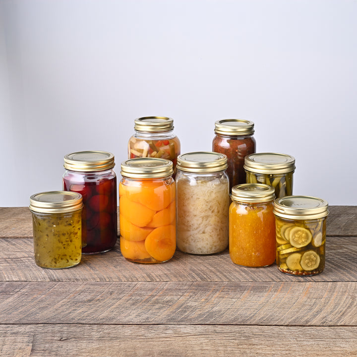 Wide mouth glass canning jar with metal lid from Superb Superb brand wide mouth mason jars stacked neatly High-quality canning jars for food storage Superb jars supporting sustainable food prep Fresh peaches preserved in wide mouth jars Assorted sizes of Superb canning jars Durable wide mouth jars made for home canning Superb canning jar set with both lid sizes Rustic kitchen shelf with Superb jars Superb jars used in farmhouse food prep