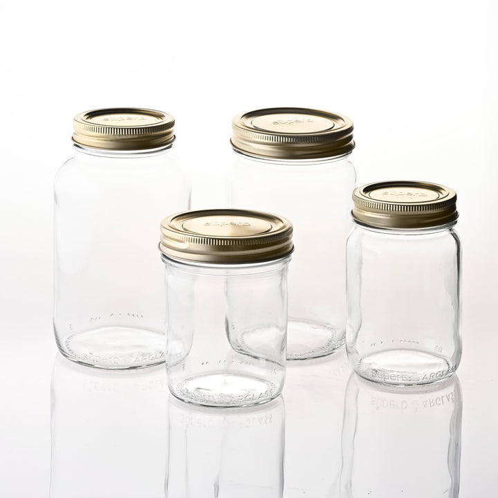 Wide mouth glass canning jar with metal lid from Superb Assorted sizes of Superb canning jars Regular mouth canning jar set on kitchen counter Regular mouth canning jar with airtight lid High-quality canning jars for food storage Durable wide mouth jars made for home canning Superb canning jar set with both lid sizes Standard regular mouth lid on matching jar Jar size variety offered by Superb