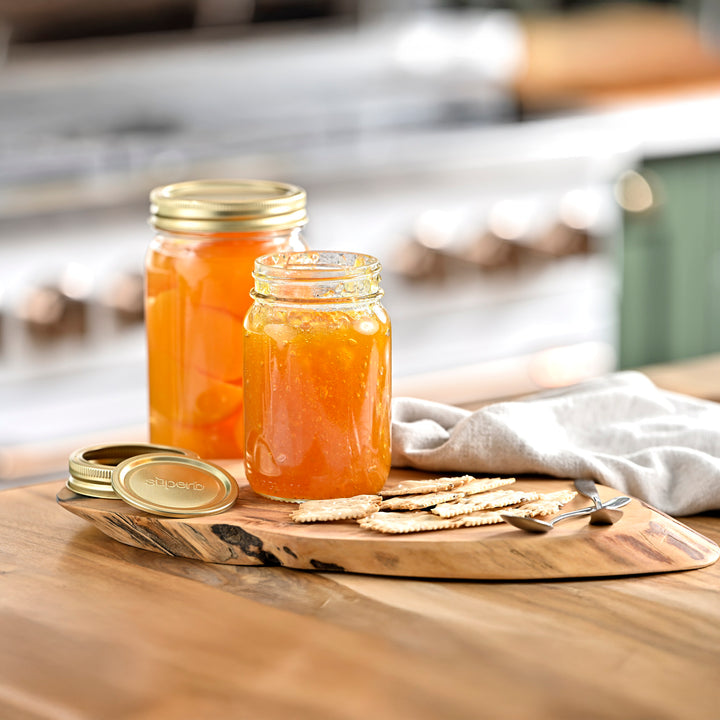 Wide mouth glass canning jar with metal lid from Superb Superb brand wide mouth mason jars stacked neatly High-quality canning jars for food storage Superb jars supporting sustainable food prep Fresh peaches preserved in wide mouth jars