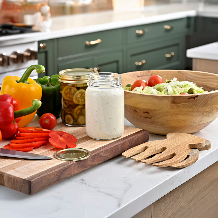 Regular mouth pint canning jar set on kitchen counter Wide mouth pint canning jar set on kitchen counter Regular mouth canning jar with airtight lid High-quality canning jars for food storage Pickled cucumbers sealed in regular mouth jar Superb jars used in farmhouse food prep Sunlit countertop with filled canning jars