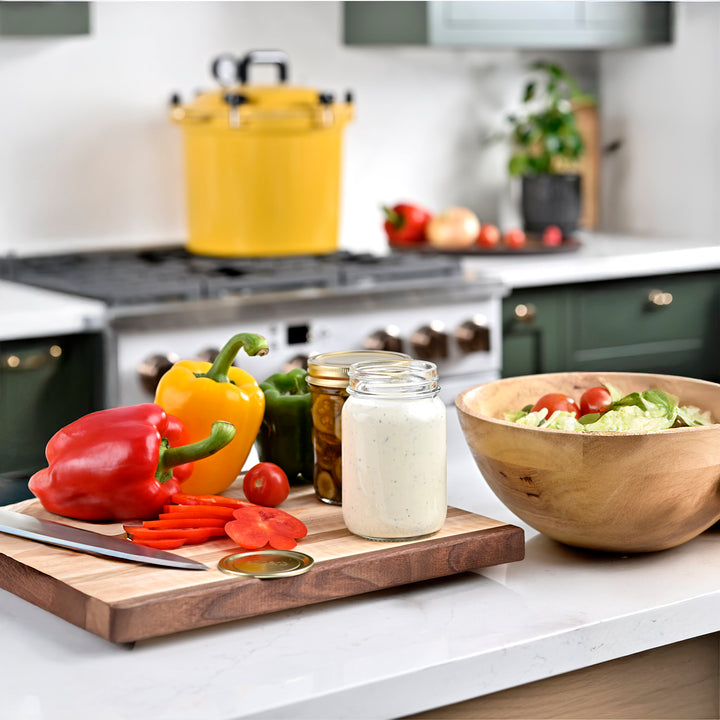 Regular mouth pint canning jar set on kitchen counter Wide mouth pint canning jar set on kitchen counter Regular mouth canning jar with airtight lid High-quality canning jars for food storage Pickled cucumbers sealed in regular mouth jar Superb jars used in farmhouse food prep Sunlit countertop with filled canning jars